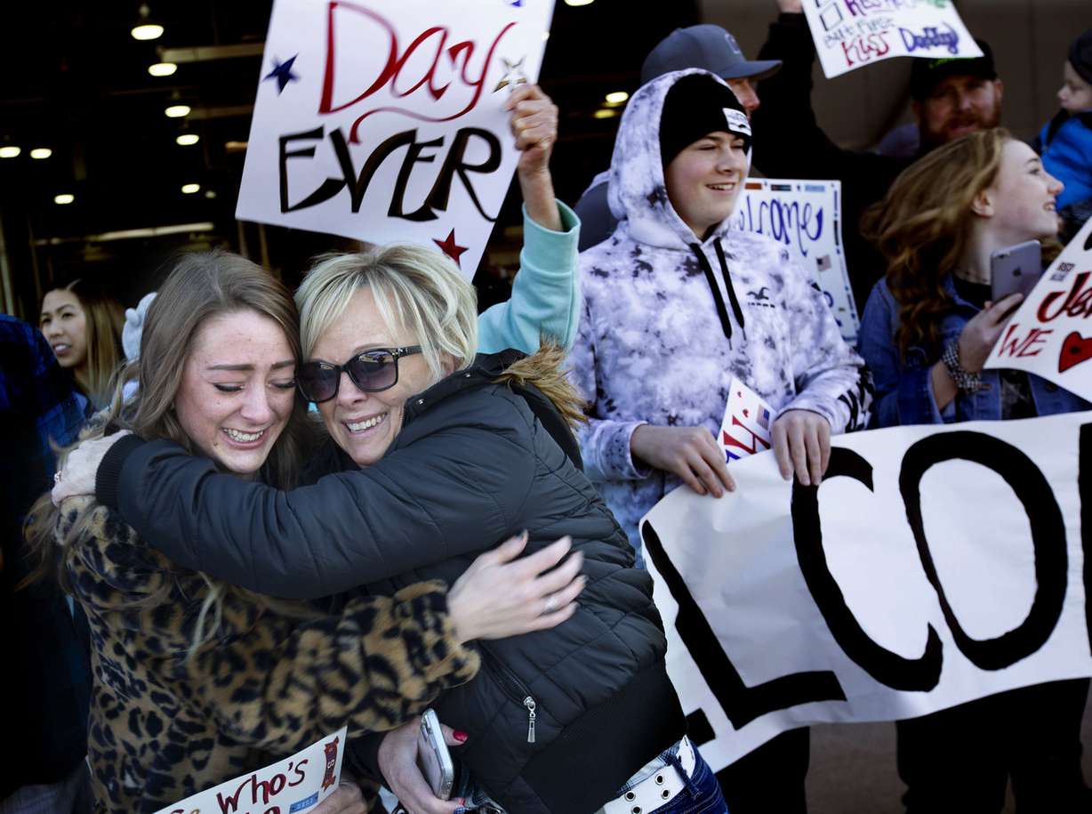 Tiffani Prince and her mother, Danelle Raymond, embrace as an airplane carrying soldiers with the Utah Army National Guard’s 65th Field Artillery Brigade lands at the Utah Air National Guard’s Roland R. Wright Air Base in Salt Lake City on Thursday, Jan. 31, 2019. (Photo: Laura Seitz, KSL)