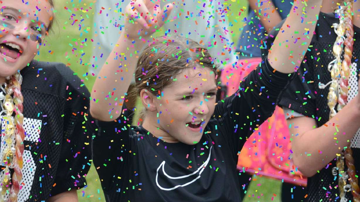 Young Sam Gordon celebrates a victory. (Photo: Utah Girl's Tackle Football League)