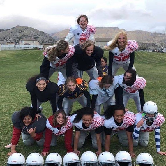 A team of the Utah Girls Tackle Football League posing in a pyramid. (Photo: Utah Girls Tackle Football League)