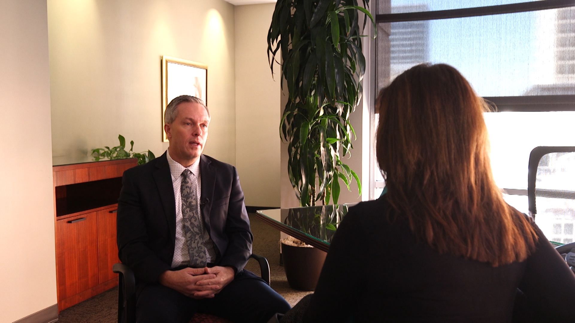 Shane Stewart, a certified financial planner, talks with KSL's Debbie Dujanovic. Photo: KSL TV