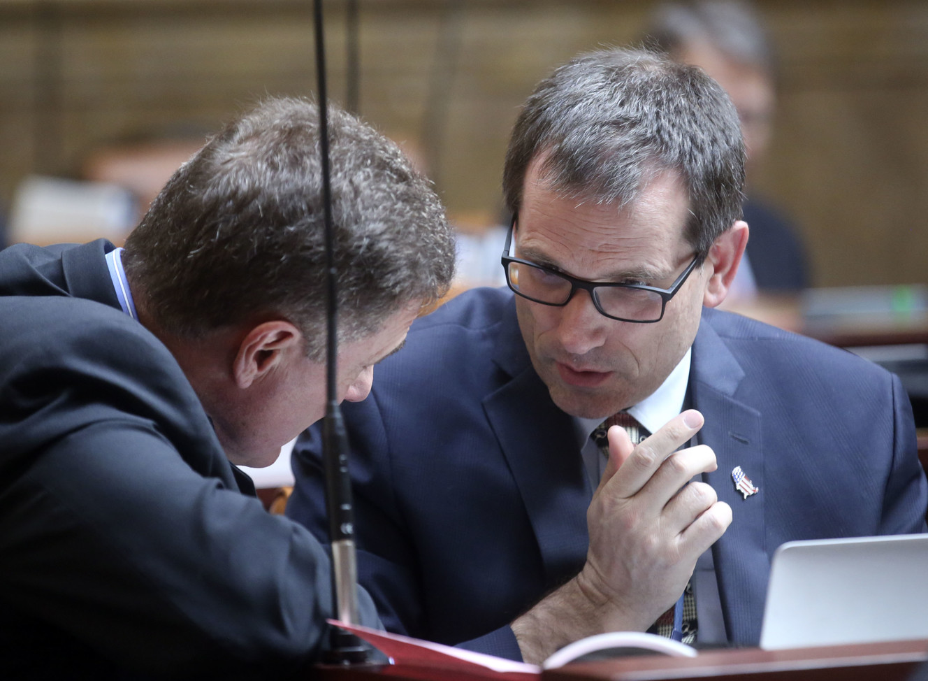 Rep. Jim Dunnigan, R-Taylorsville, and Rep. Ray Ward, R-Bountiful, discuss Proposition 3 in the House chamber during the morning legislative session at the Capitol in Salt Lake City on Tuesday, Feb. 5, 2019. (Photo: Kristin Murphy, KSL)