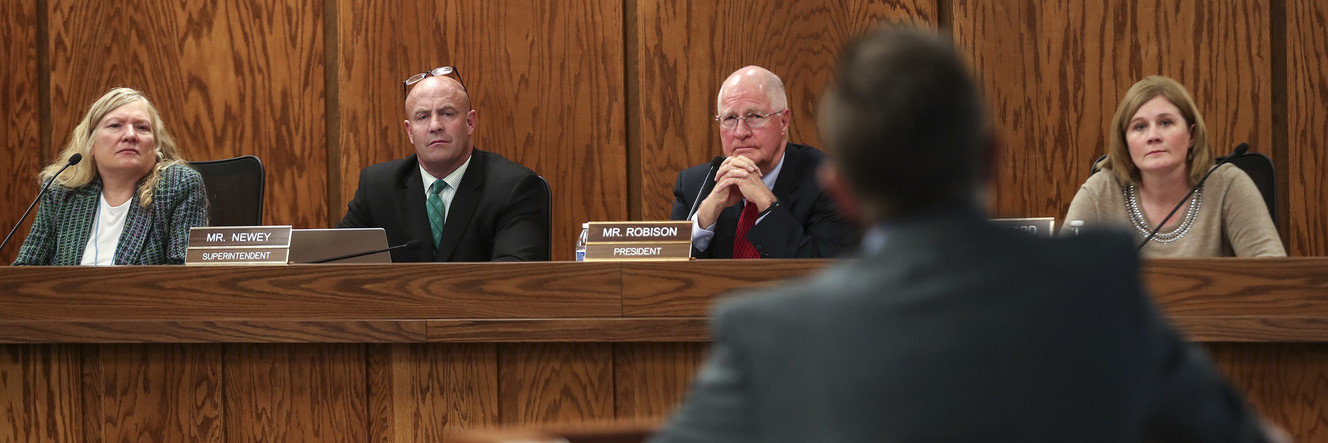 Cheryl Phipps, board member, Davis School District Board of Education, left; Reid Newey, superintendent, Davis School District; John Robison, president of the Davis School District Board of Education; and Liz Mumford, vice-president of the Davis School District Board of Education, listen to Vanner Johnson, the father of a current and a former student at Washington Elementary School in Bountiful, as he talks about the closure of the school during meeting at the Davis School District offices in Farmington on Tuesday, Feb. 5, 2019. Photo: Steve Griffin, KSL