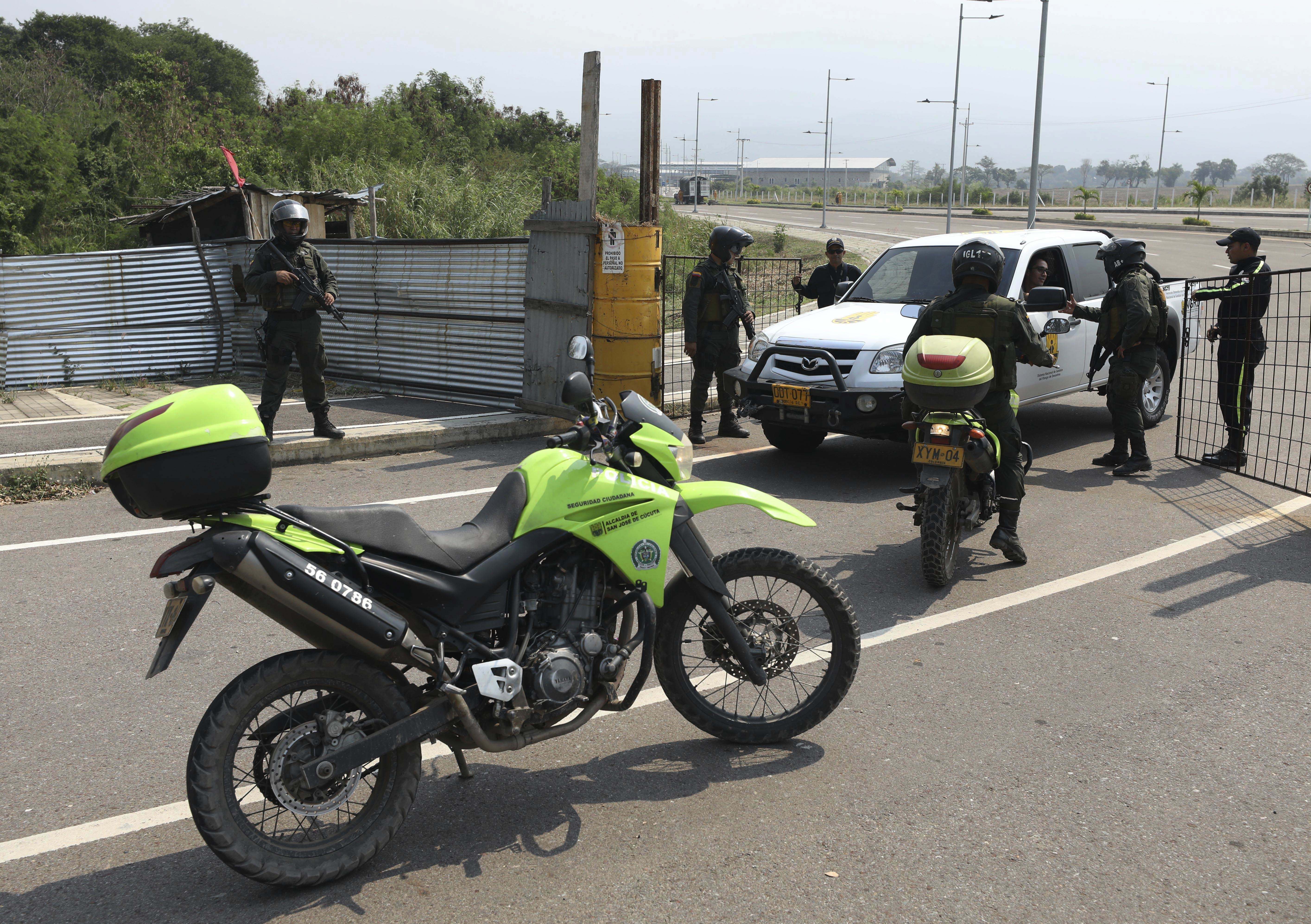 Venezuela military barricades bridge in attempt to block aid