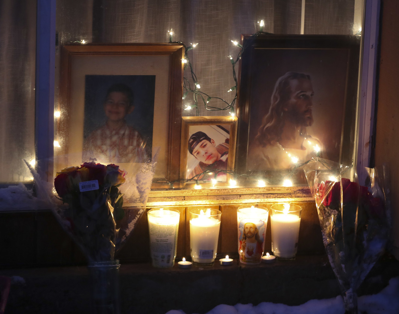 Candles illuminate photos of Marquez Grajeda during a vigil for the 15-year-old who was fatally shot in a West Valley City on Tuesday, Feb. 5, 2019. Family and friends attended the vigil in West Valley City on Wednesday, Feb. 6, 2019. (Photo: Steve Griffin, KSL)