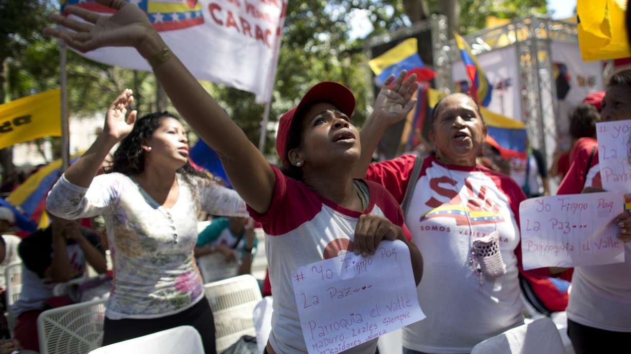 The Latest: China says dialogue only way to Venezuela peace