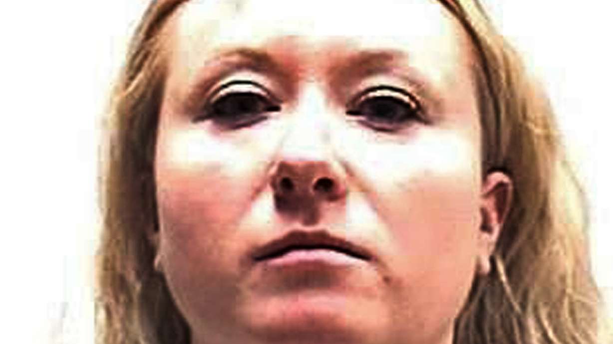 The Latest: Woman says she moved phone in Colorado murder