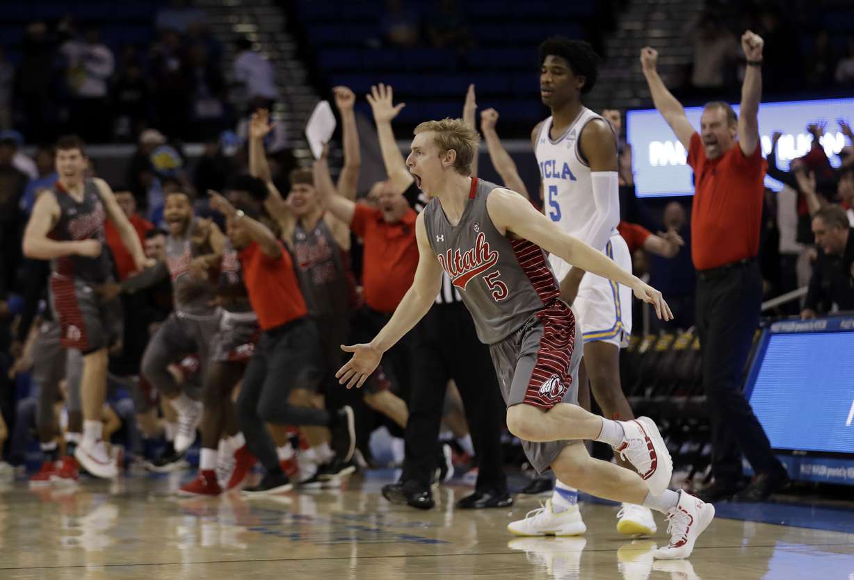 Utah guard Parker Van Dyke, center, celebrates his winning three-point basket next to UCLA guard Chris Smith, center right, as time expires during the second half of an NCAA college basketball game Saturday, Feb. 9, 2019, in Los Angeles. (Marcio Jose Sanchez, AP Photo)