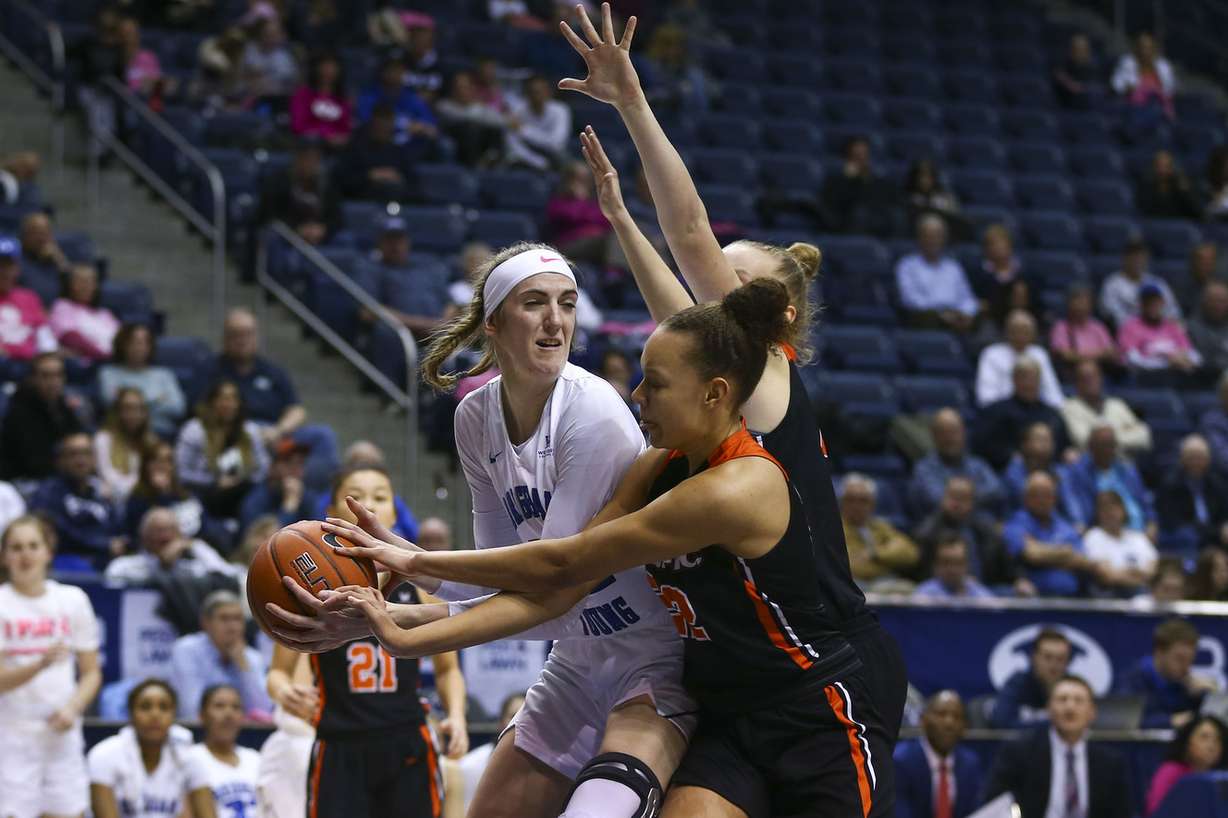 BYU Cougars center Sara Hamson (22) looks to pass the ball while guarded by Pacific Tigers players at the Marriott Center in Provo on Saturday, Feb. 9, 2019. (Photo: Silas Walker, Deseret News)