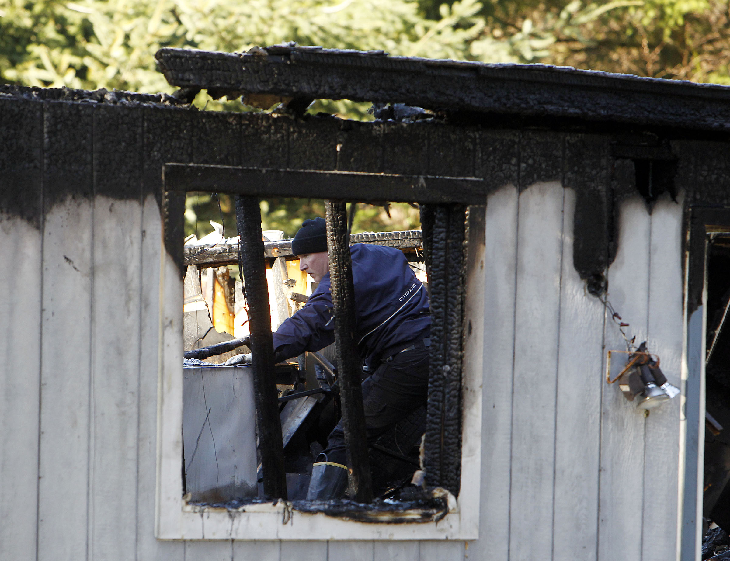 Officials investigate at the home of Josh Powell in Graham, Wash., on Monday, Feb. 6, 2012. (Photo: Ravell Call, KSL, File)