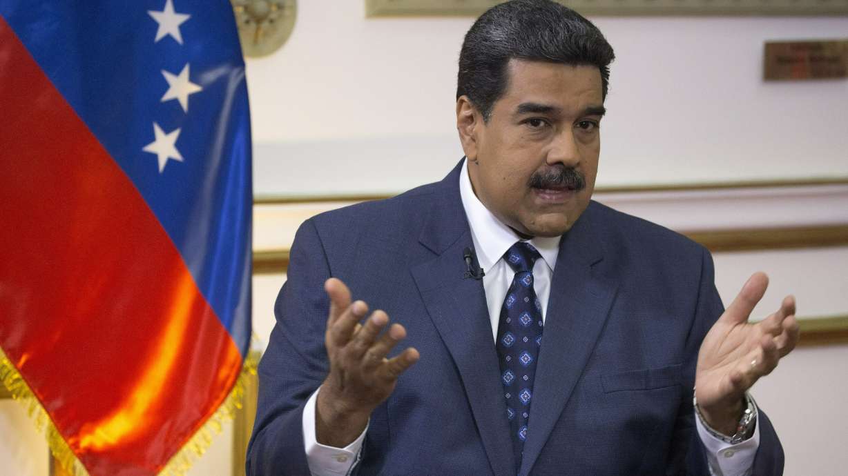 The Latest: US announces sanctions against Maduro officials