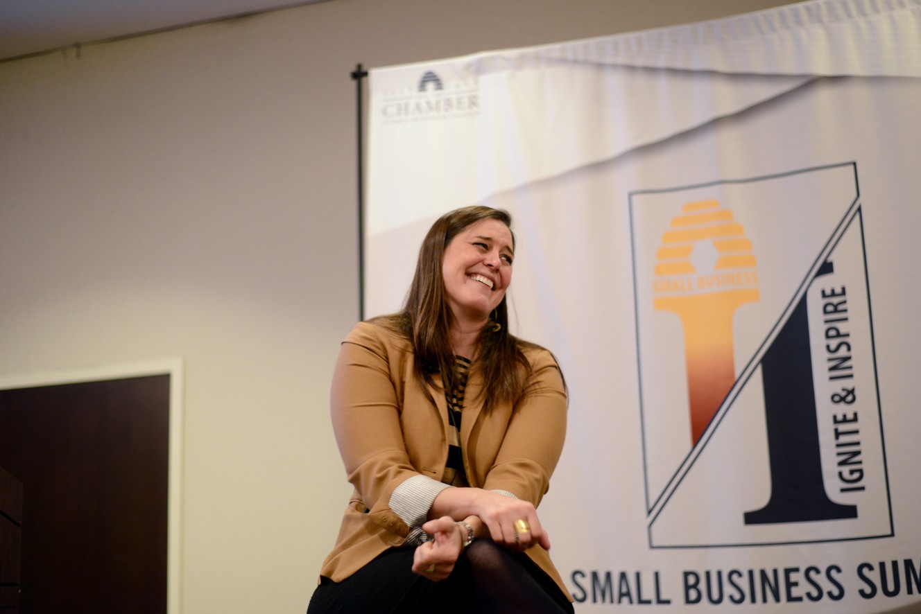 Sarah Calhoun, founder and owner of Red Ants Pants, laughs as she speaks with Kimberly Flores, director of public relations and communication for the Salt Lake Chamber, at the Salt Lake City Marriott University Park during the chamber's Small Business Summit on Friday, Feb. 15, 2019. Calhoun was the featured speaker. (Photo: Salt Lake Chamber)