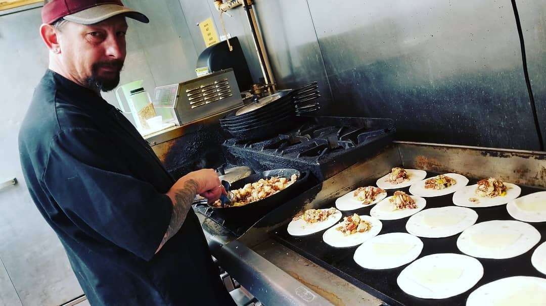 Ron Davidson mans the grill at Jessie Jean's cafe. (Photo: Jessie Jean's)