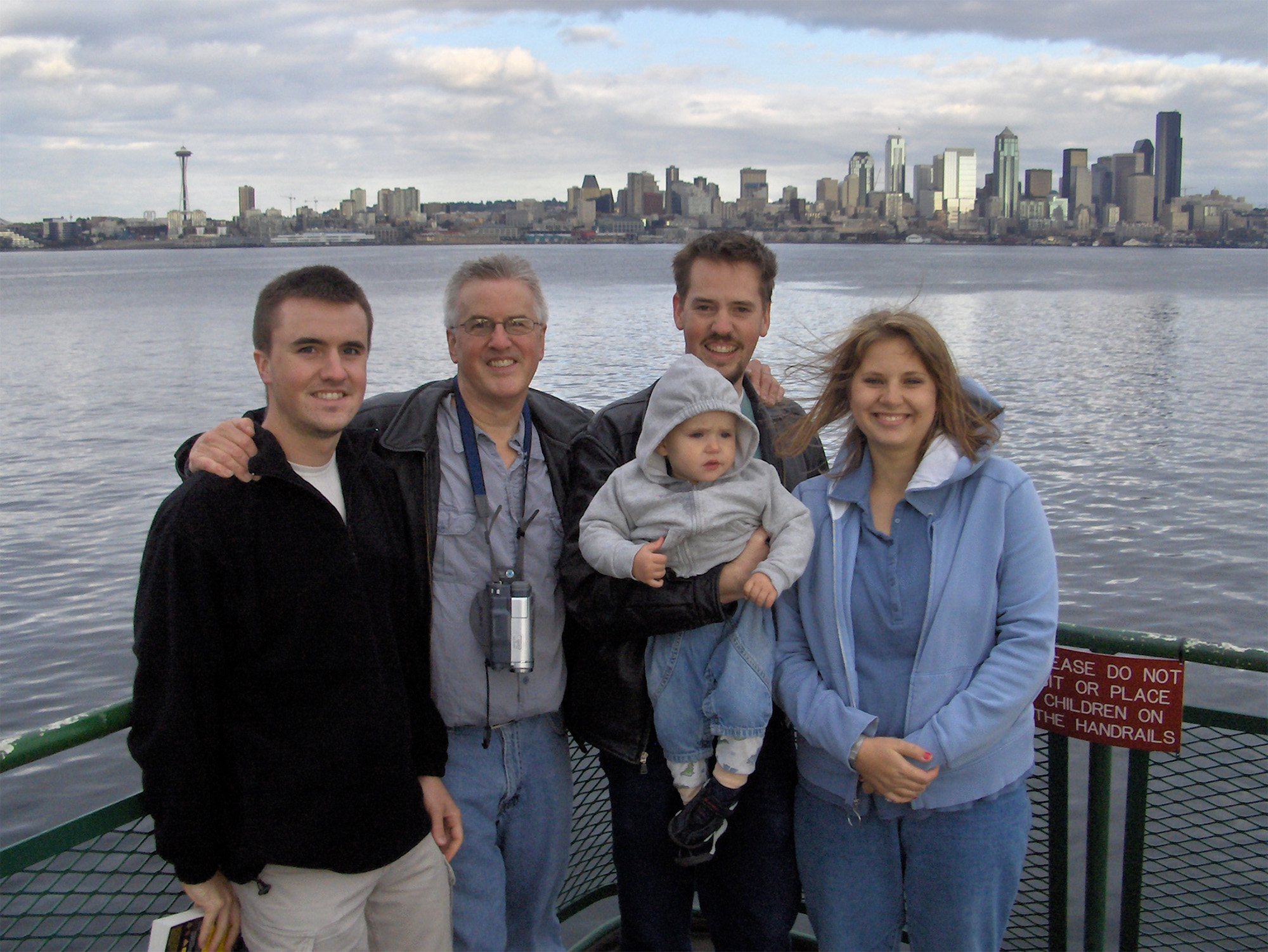 West Valley police recovered this family photo from one of Josh Powell's digital devices. It shows, from left, Michael Powell, Steve Powell, Charlie Powell, Josh Powell and Susan Powell posing in front of the skyline in Seattle, Wash. Metadata suggests the photo was taken on Sept. 30, 2006. (Family photo)