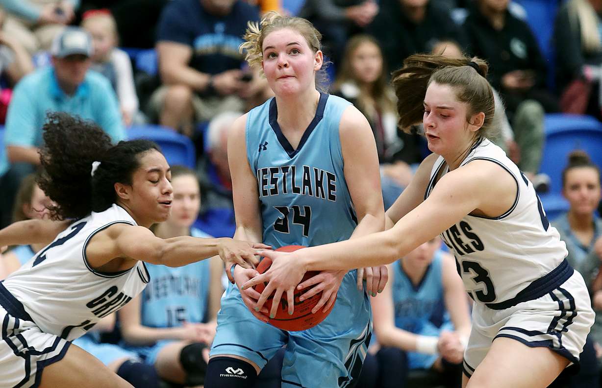 Copper Hills' Eleyana Tafisi, left, and Breaunna Gillen try to force a turnover against Westlake in 6A quarterfinal basketball action at Salt Lake Community College in Taylorsville on Wednesday, Feb. 20, 2019. (Photo: Scott G Winterton, Deseret News)