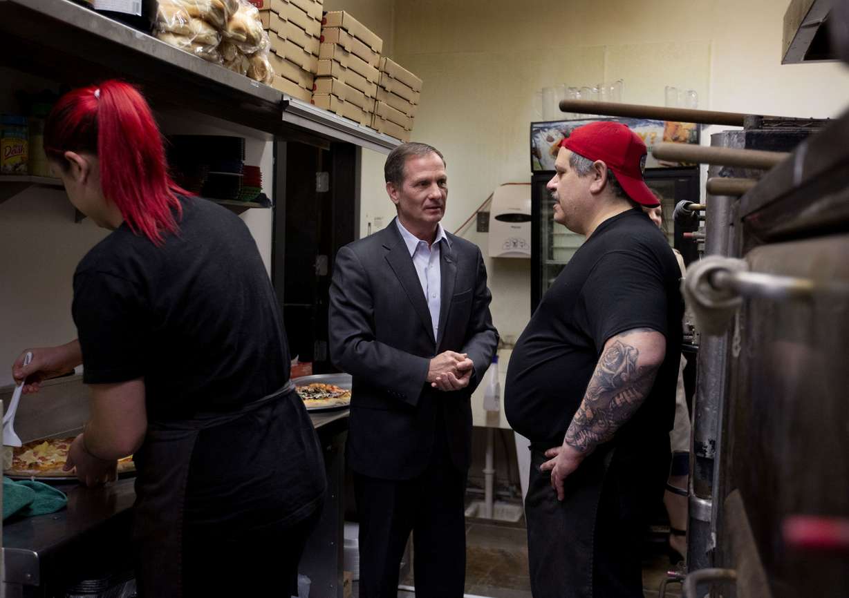 Rep. Chris Stewart, R-Utah, center, talks to Nisa Randazzo and her father, Sebastian, in the kitchen at Nonna's Italian Restaurant & Pizzeria in Magna before a town hall meeting on Thursday, Feb. 21, 2019. (Photo: Laura Seitz, KSL)