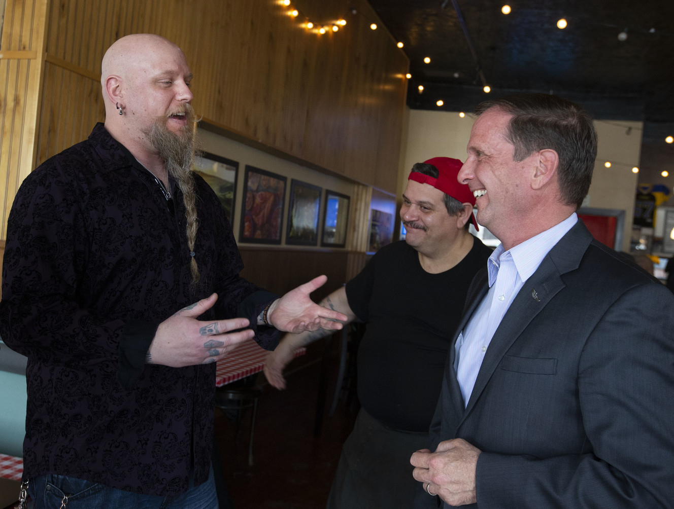 A.W. Storm Anderson, left, and Sebastian Randazzo speak with Rep. Chris Stewart, R-Utah, after a town hall meeting at Nonna's Italian Restaurant & Pizzeria in Magna on Thursday, Feb. 21, 2019. (Photo: Laura Seitz, KSL)