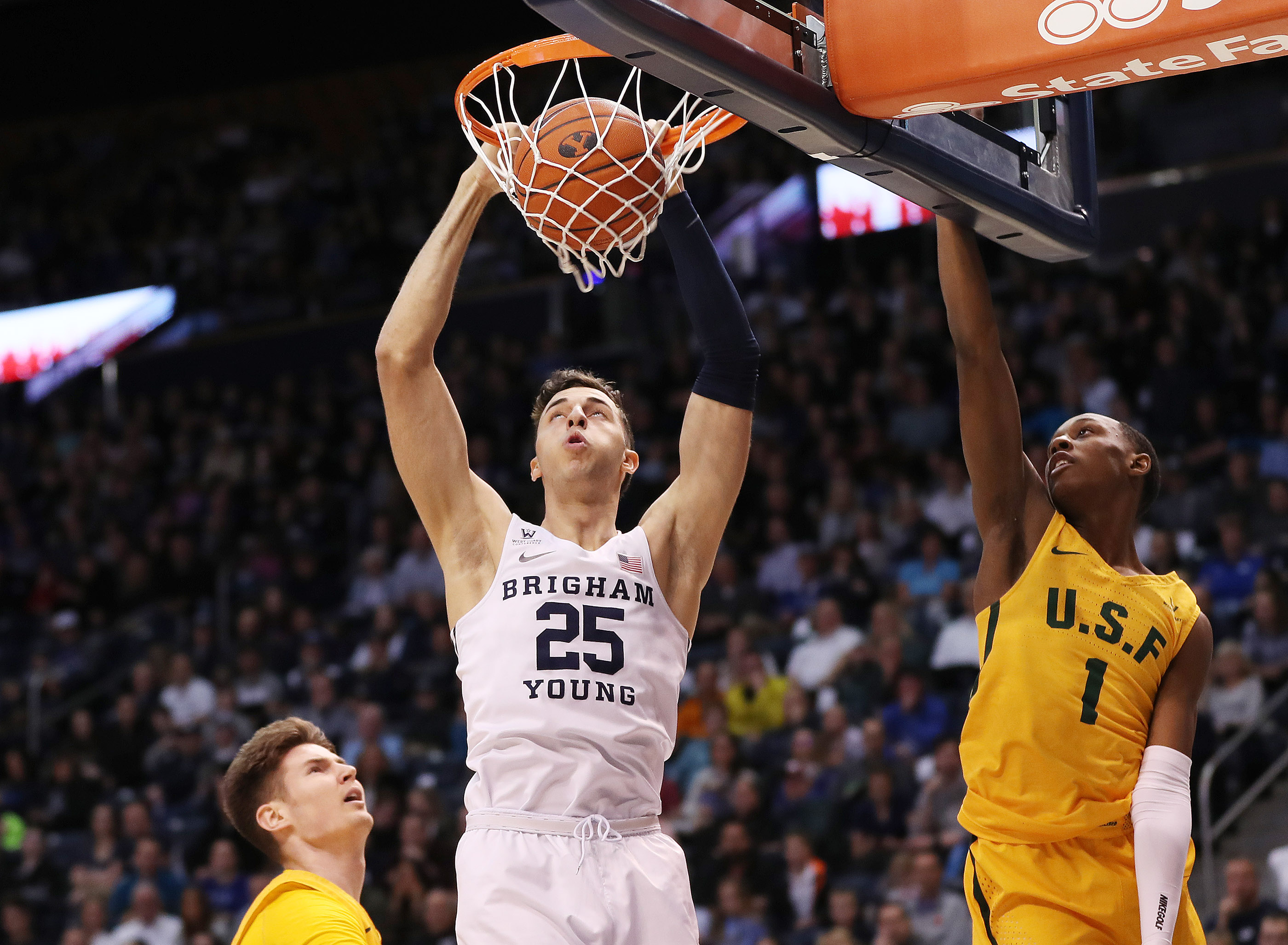 Brigham Young Cougars forward Gavin Baxter (25) dunks on San Francisco Dons guard Jamaree Bouyea (1) in Provo on Thursday, Feb. 21, 2019. (Photo: Jeffrey D. Allred, KSL)