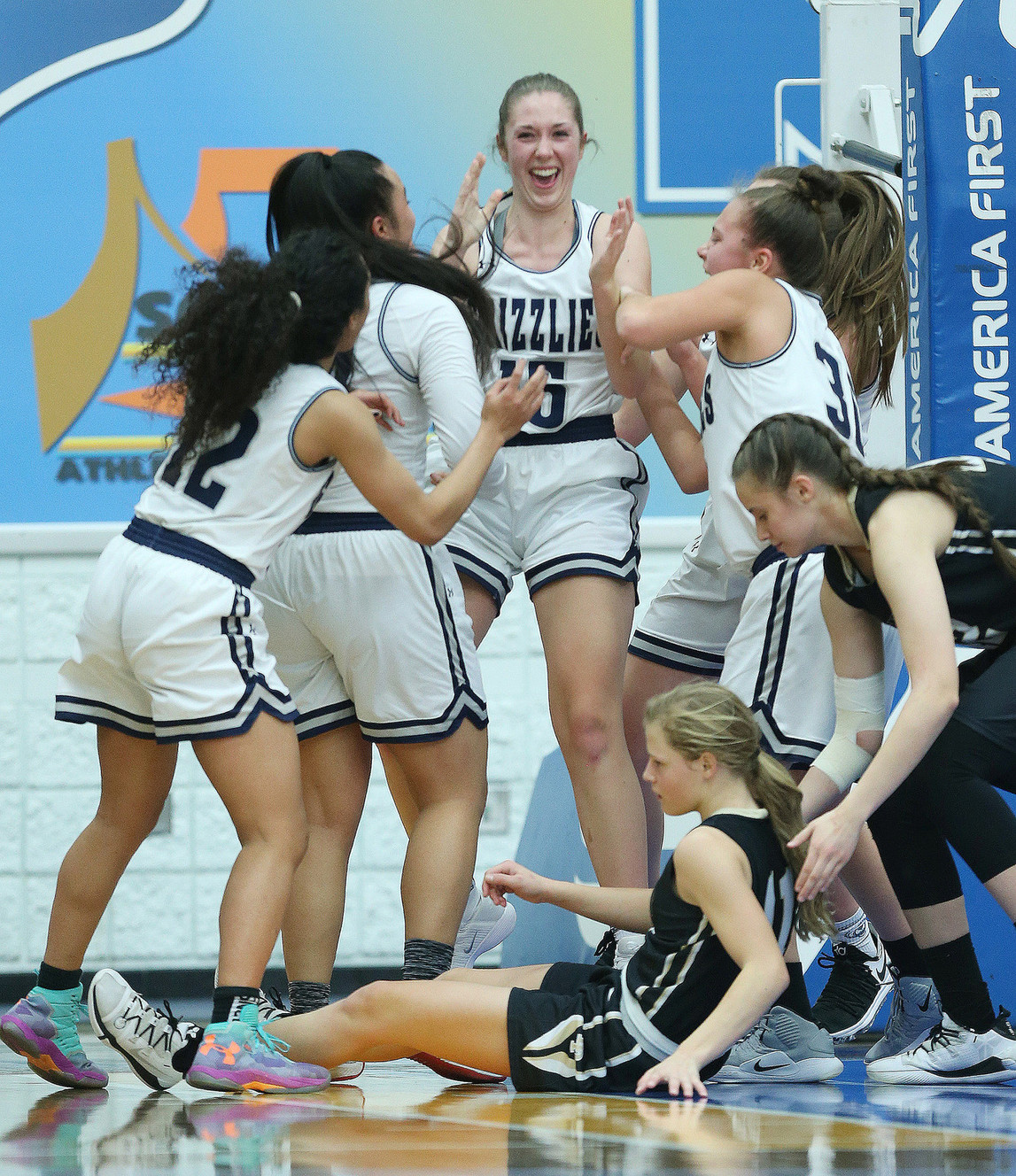 Copper Hills' Emily Larsen (15) and teammates cheers after she took a charge on Lone Peak's Maddy Eaton (5) in the girls 6A semifinal game in Taylorsville on Friday, Feb. 22, 2019. Copper Hills won 51-34. (Photo: Jeffrey D. Allred, Deseret News)