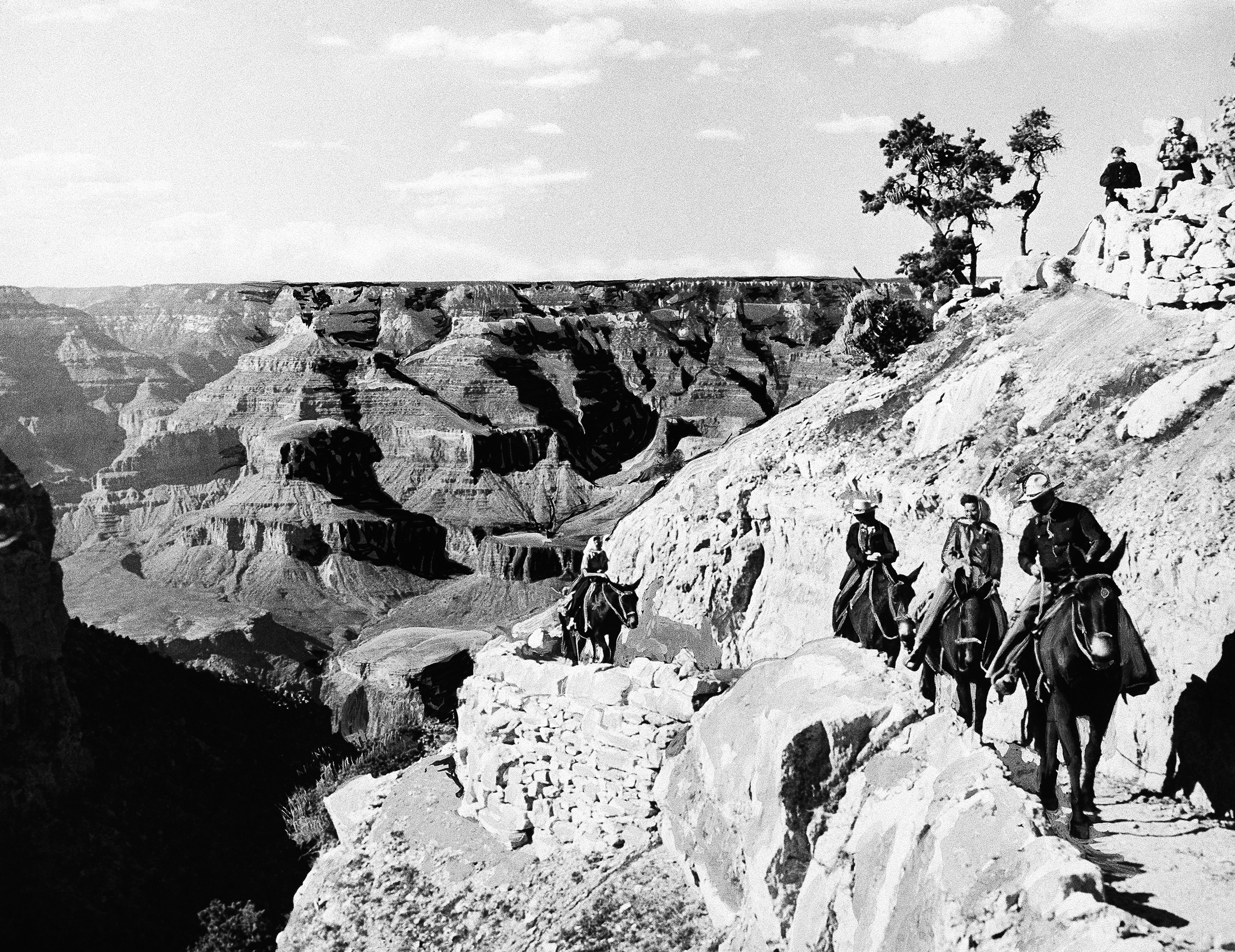 A group on horseback travel up a path at the Grand Canyon in Arizona, June 8, 1938. (AP Photo, File)