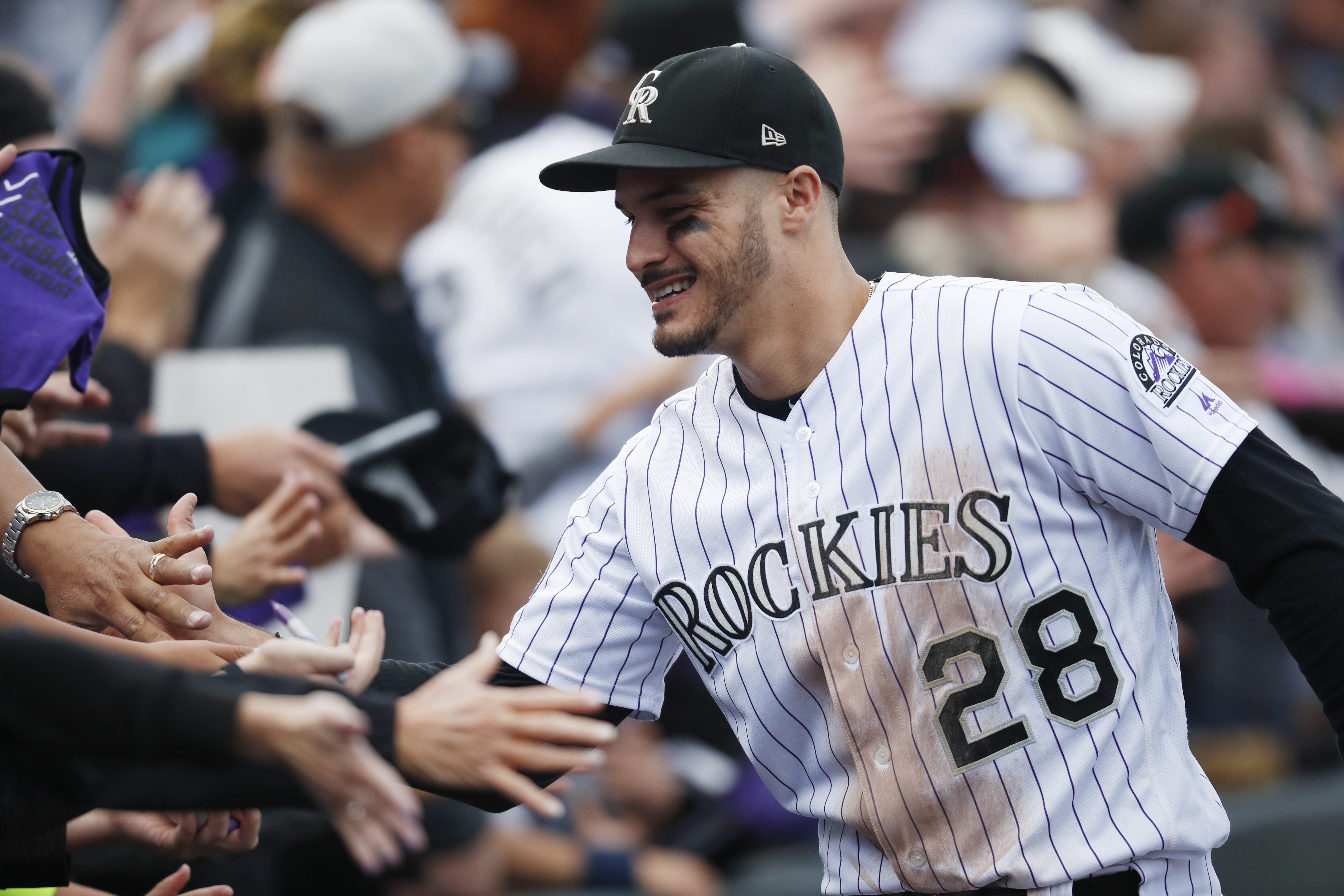 Arenado, Rockies reach 8-yr deal; AP source says worth $260M