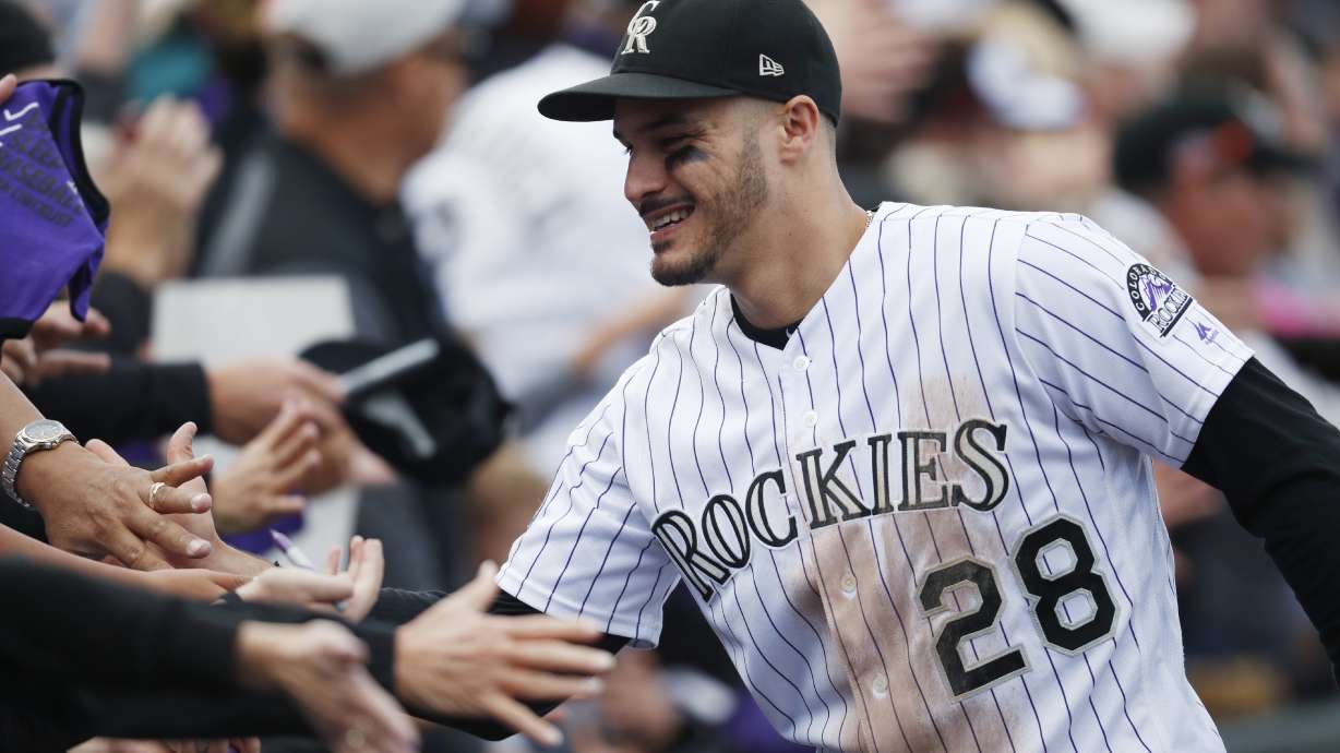 Arenado, Rockies reach 8-yr deal; AP source says worth $260M
