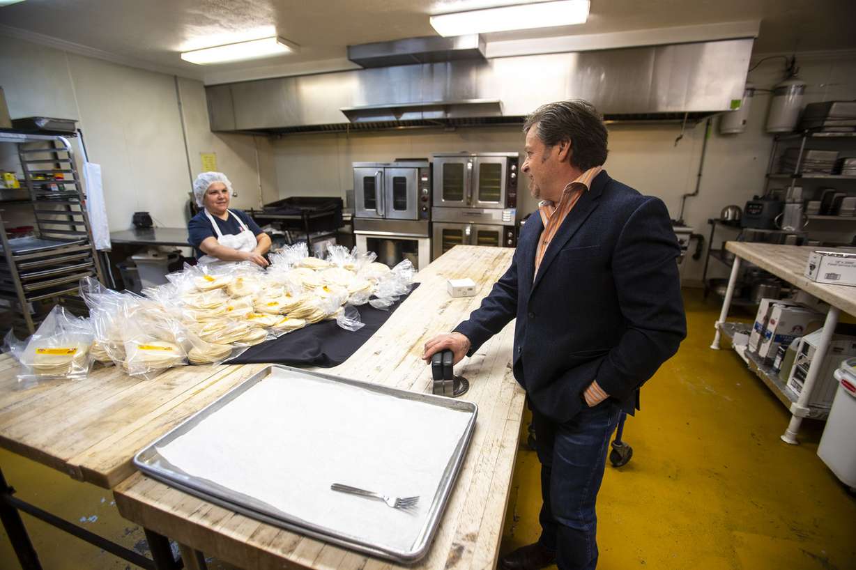 Jorge Fierro, owner of Rico Brand products, checks on an order as he shows off his distribution facility and restaurant in Salt Lake City on Tuesday, Feb. 26, 2019. (Photo: Scott G Winterton, KSL)