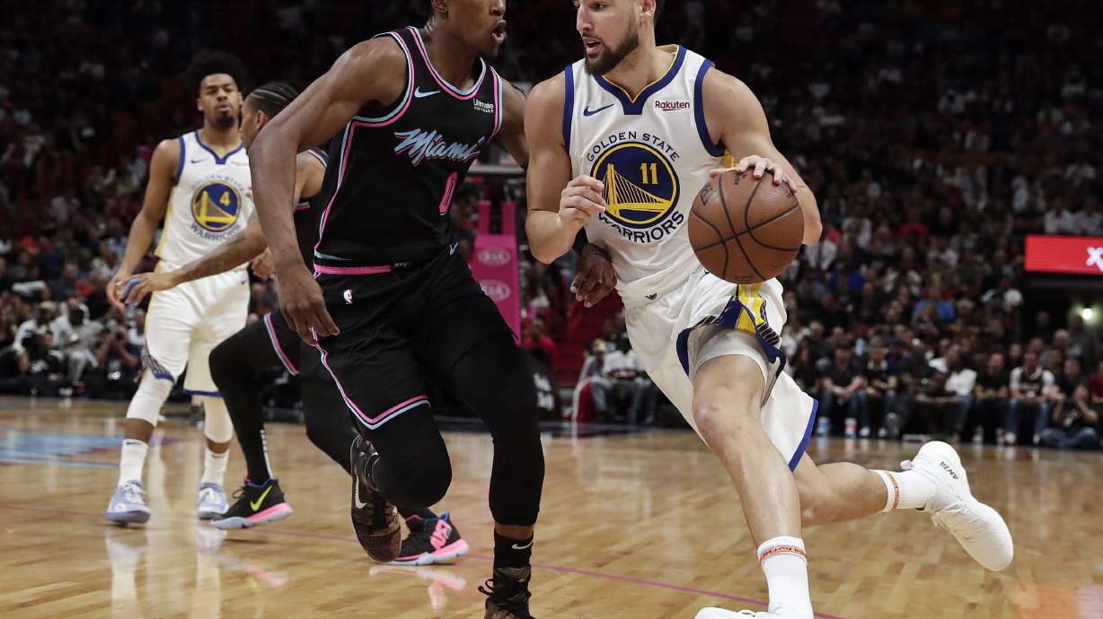 Wade banks in straightaway 3 to lift Heat past Warriors
