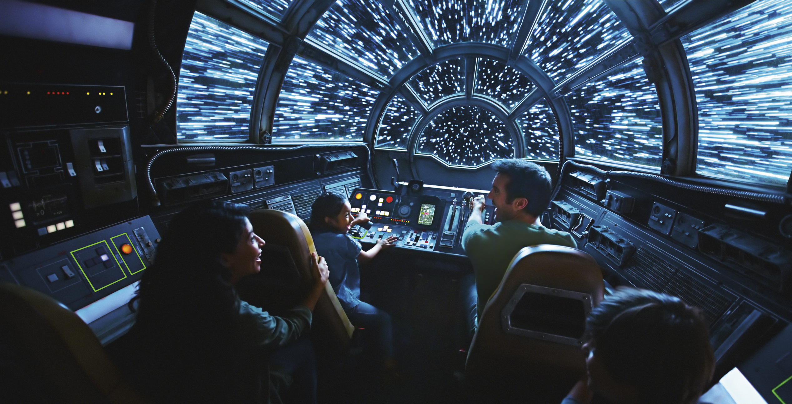 This rendering released by Disney and Lucasfilm shows people on the planned Inside Millennium Falcon: Smugglers Run attraction, part of Star Wars: Galaxy's Edge a 14-acre area set to open this summer at the Disneyland Resort in Anaheim, California, then in the fall at Disney’s Hollywood Studios in Orlando, Florida. (Disney Parks/Lucasfilm via AP)