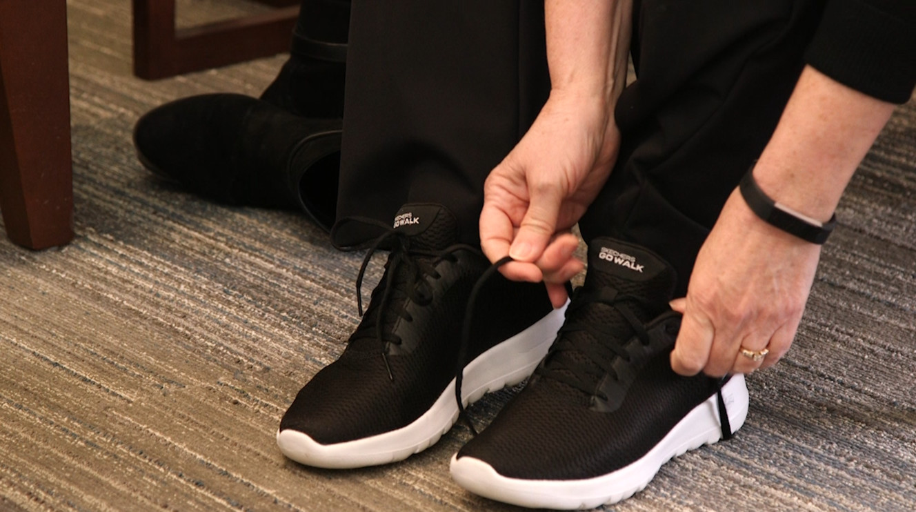 Deana Williams trades her work shoes for her tennis shoes. (Photo: KSL TV)