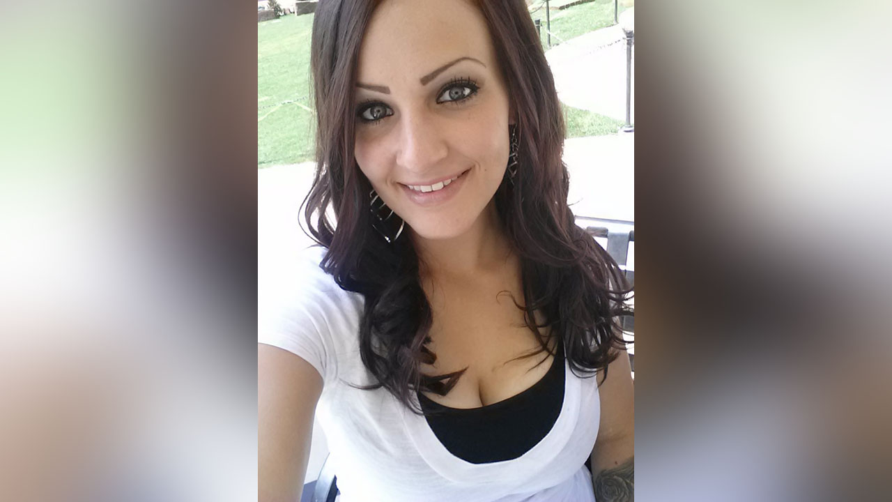 Woman may have received message on phone moments before being shot, warrant states