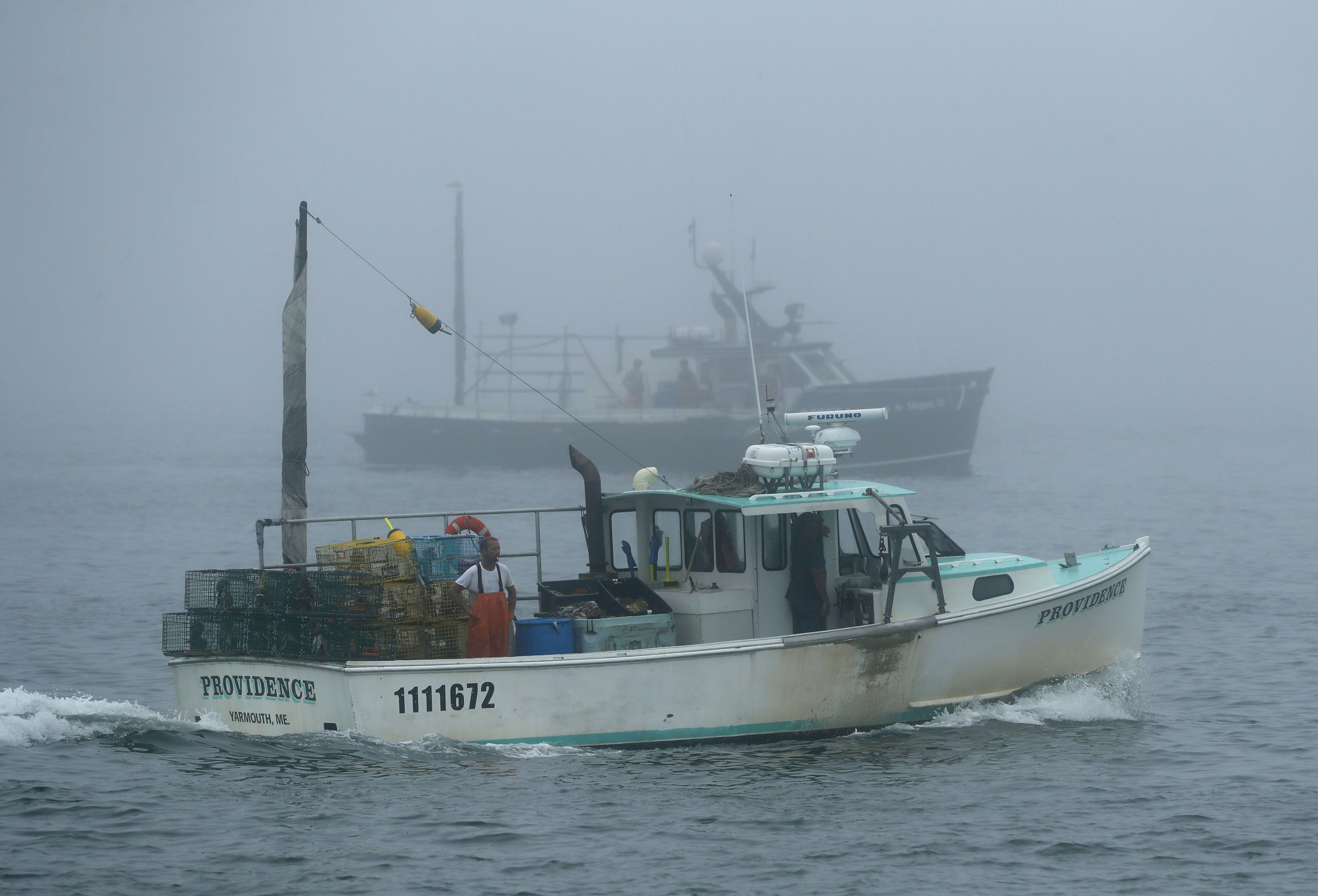 The Latest: Maine's lobster haul, value grew last year