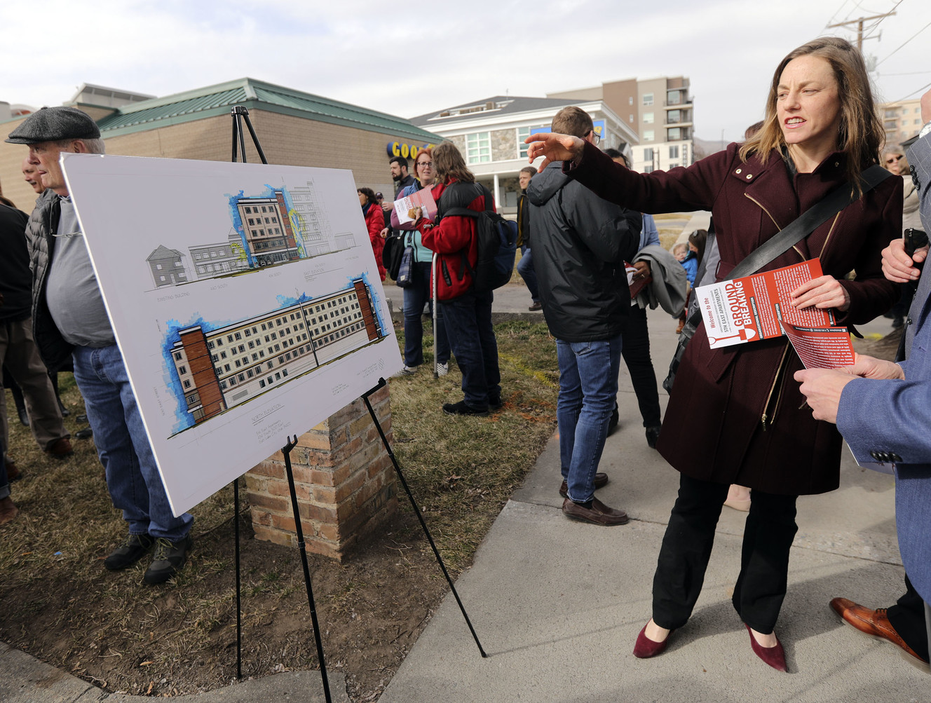 Laura Smith looks at a rendering of the latest phase of the First Step House Recovery Campus during a groundbreaking ceremony in Salt Lake City on Friday, March 1, 2019. (Photo: Kristin Murphy, KSL)