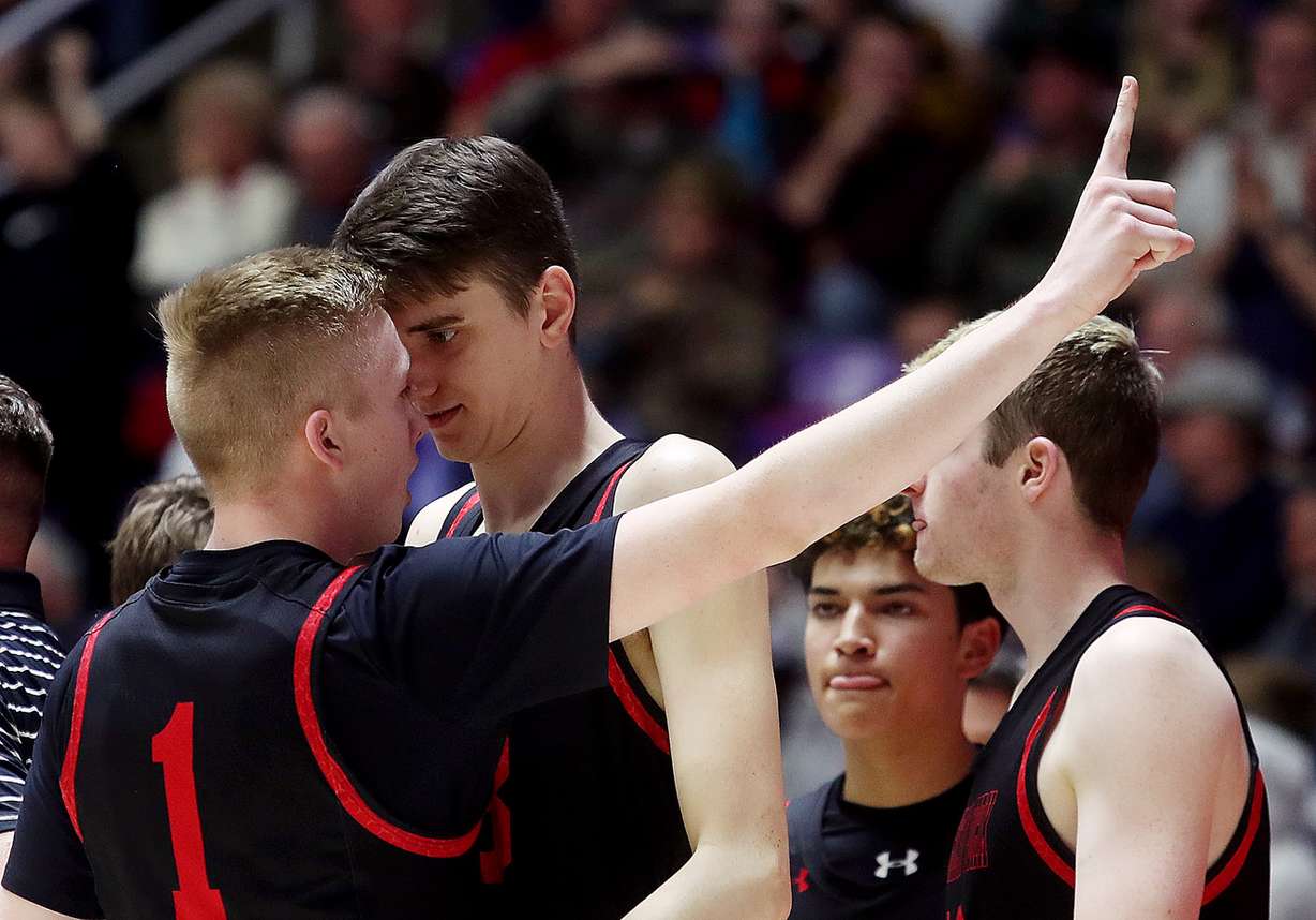 American Fork's Tanner Cuff (1) holds up a finger as teammate Isaac Johnson celebrates as Davis and American Fork play in 6A semifinal basketball action at Weber State's Dee Events Center in Ogden on Friday, March 1, 2019. American Fork won in triple overtime 82-80 to advance to the championship. (Photo: Scott G Winterton, KSL)