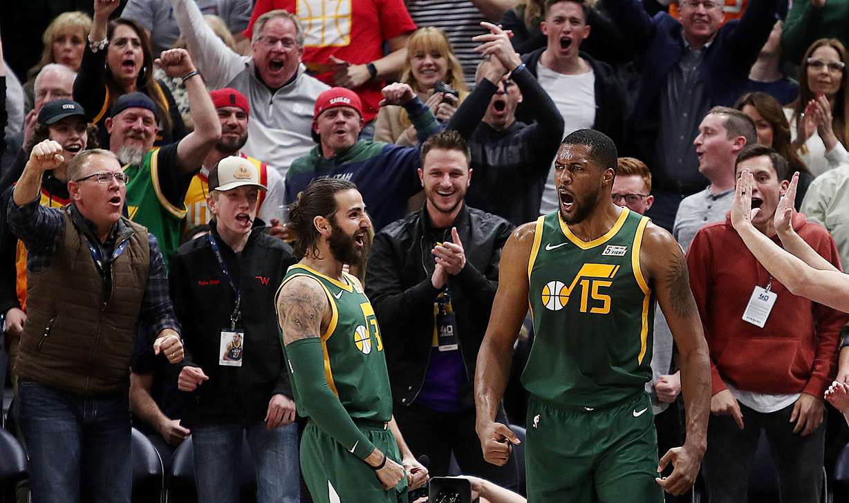 Fans go nuts as Utah Jazz guard Ricky Rubio (3) and Utah Jazz forward Derrick Favors (15) celebrate as the Utah Jazz and the Milwaukee Bucks play a Vivint Smart Home Arena in Salt Lake City on Saturday, March 2, 2019. (Scott G. Winterton, KSL)