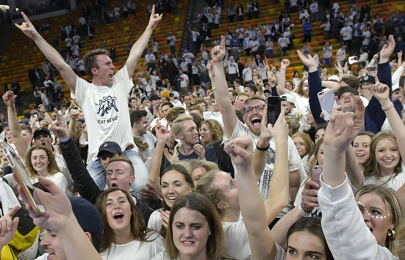 Fans celebrate on the court after Utah State defeated No. 12 Nevada 81-76 in an NCAA college basketball game Saturday, March 2, 2019, in Logan, Utah. (Photo: Eli Lucero, The Herald Journal)