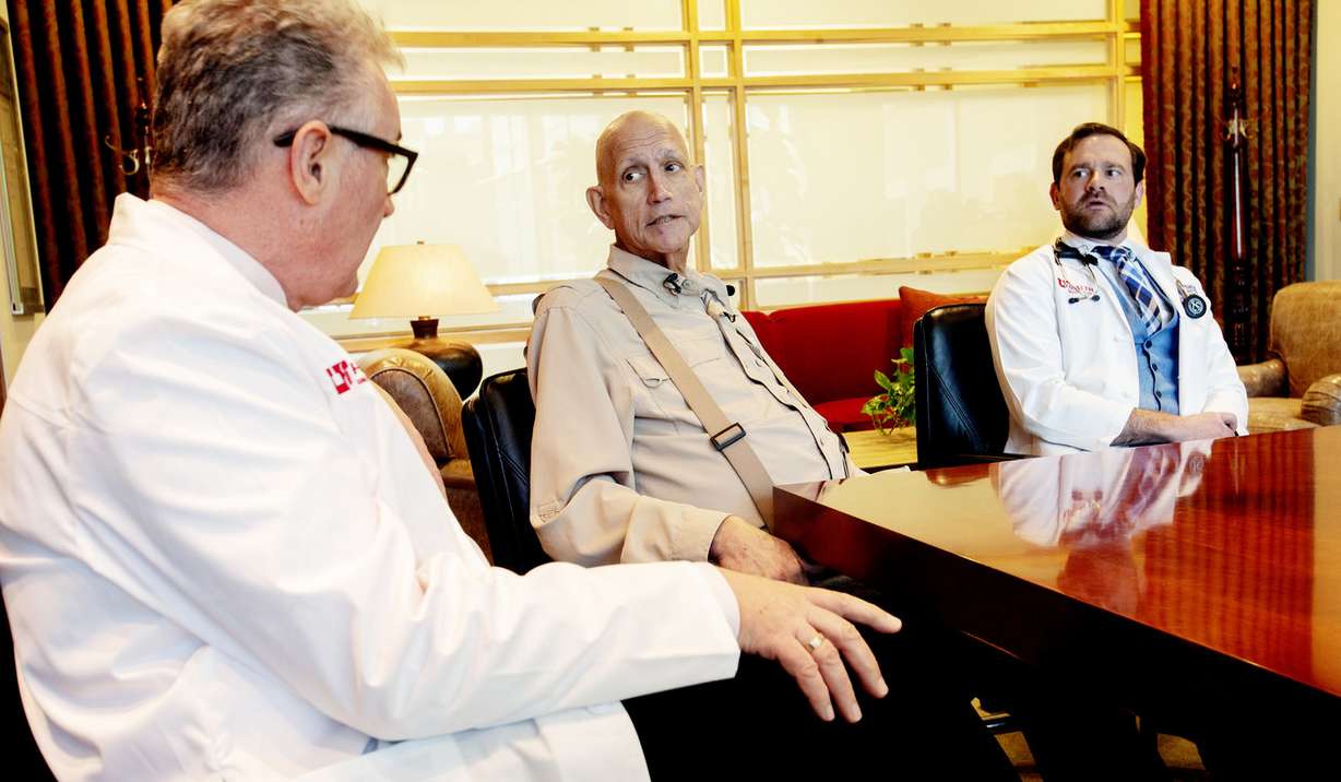 Martin McMahon, a cancer researcher at the Huntsman Cancer Institute and professor of dermatology at the University of Utah, left, Gordon Chamberlain and Chamberlain's doctor, Conan Kinsey, a physician-scientist at the institute, talk about a new treatment for pancreatic cancer and the opening of a clinical trial while visiting at the institute in Salt Lake City on Monday, March 4, 2019. Chamberlain is taking part in the study. (Photo: Scott G Winterton, KSL)