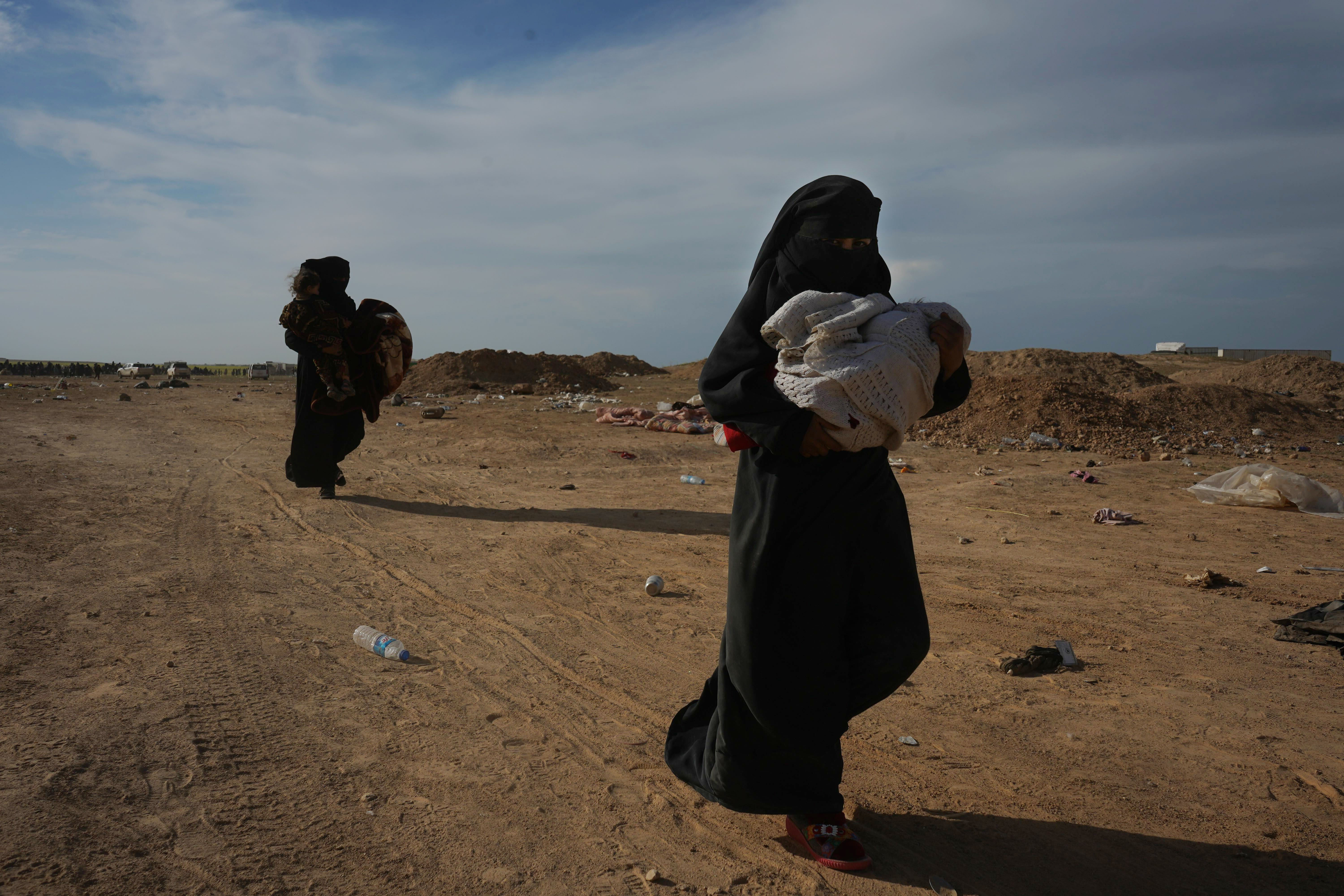 Angry and defiant, IS families surrender in Syria