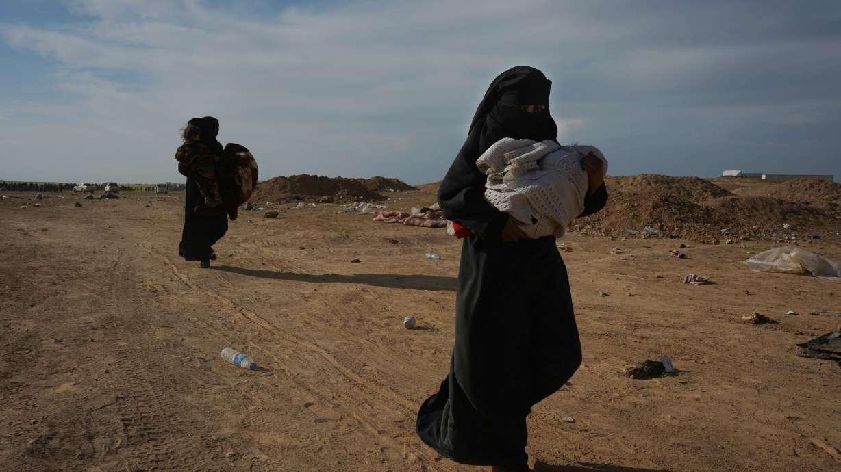 Angry and defiant, IS families surrender in Syria