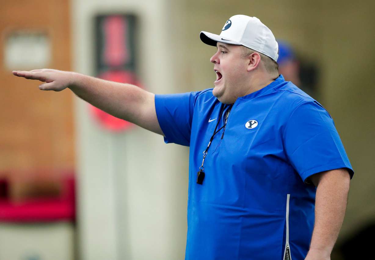 BYU offensive line coach Eric Mateos instructs athletes during the practice, Monday, March 4, 2019 in Provo. (Photo: Jaren Wilkey, BYU Photo)