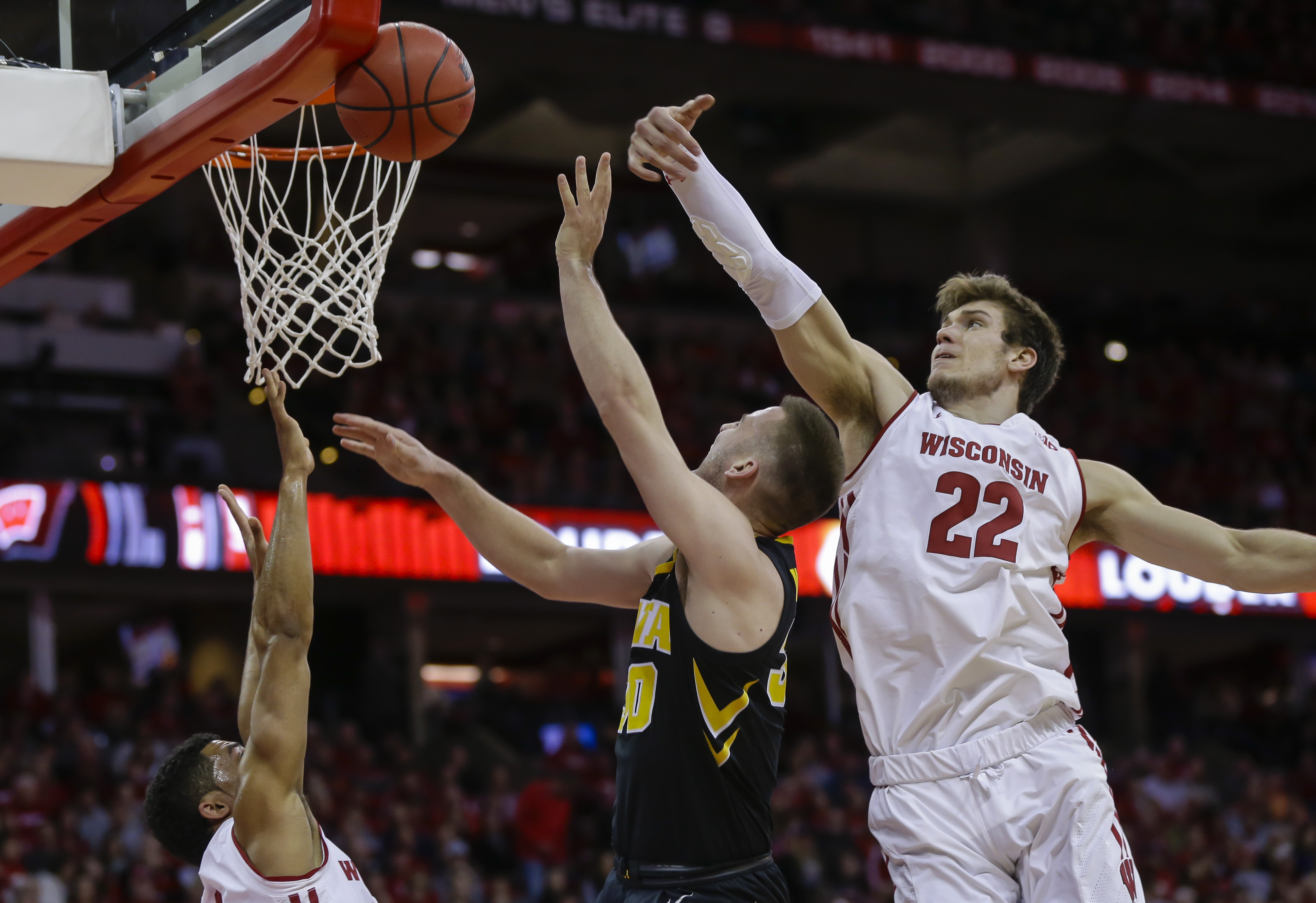 No. 21 Wisconsin routs Iowa 65-45