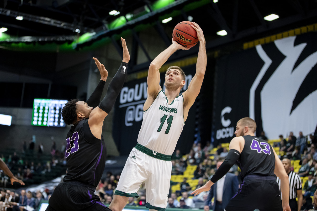 Utah Valley senior guard Conner Toolson shoots a three-point bucket on Thursday night at the UCCU Center in Orem. (Photo: Clark Clifford Wiesenberg, UVU Athletics).