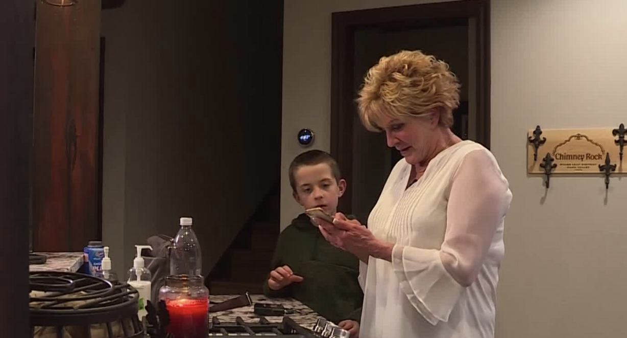 William McLeod, 9, stands with his grandmother, Karen Fisher, in their home in Bountiful on Thursday, March 7, 2019. William was forced to remove his Ash Wednesday cross at school by his teacher, but says he accepts her apology. (Photo: Andrew Adams, KSL TV)