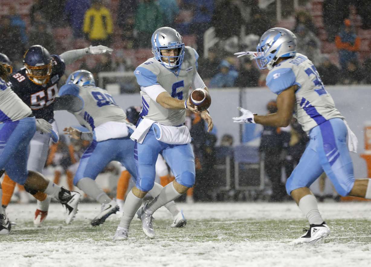 Salt Lake Stallions quarterback Josh Woodrum (6) hands the ball off to running back Joel Bouagnon, right, during the first half of an AAF football game against the Orlando Apollos, Saturday, March 2, 2019, at Rice-Eccles Stadium in Salt Lake City. (Photo: Kim Raff, AP)