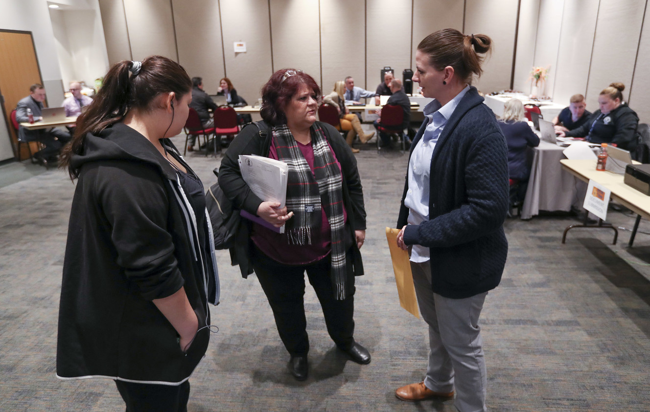 Elizabeth Rivera, center, and her granddaughter Elisa Gonzalez talk with Salt Lake police detective Jessica Kilgore as they attend the Salt Lake City Police Department's inaugural Missing In Utah event at the Miller Conference Center in Sandy on Saturday, March 9, 2019. (Photo: Steve Griffin, KSL)