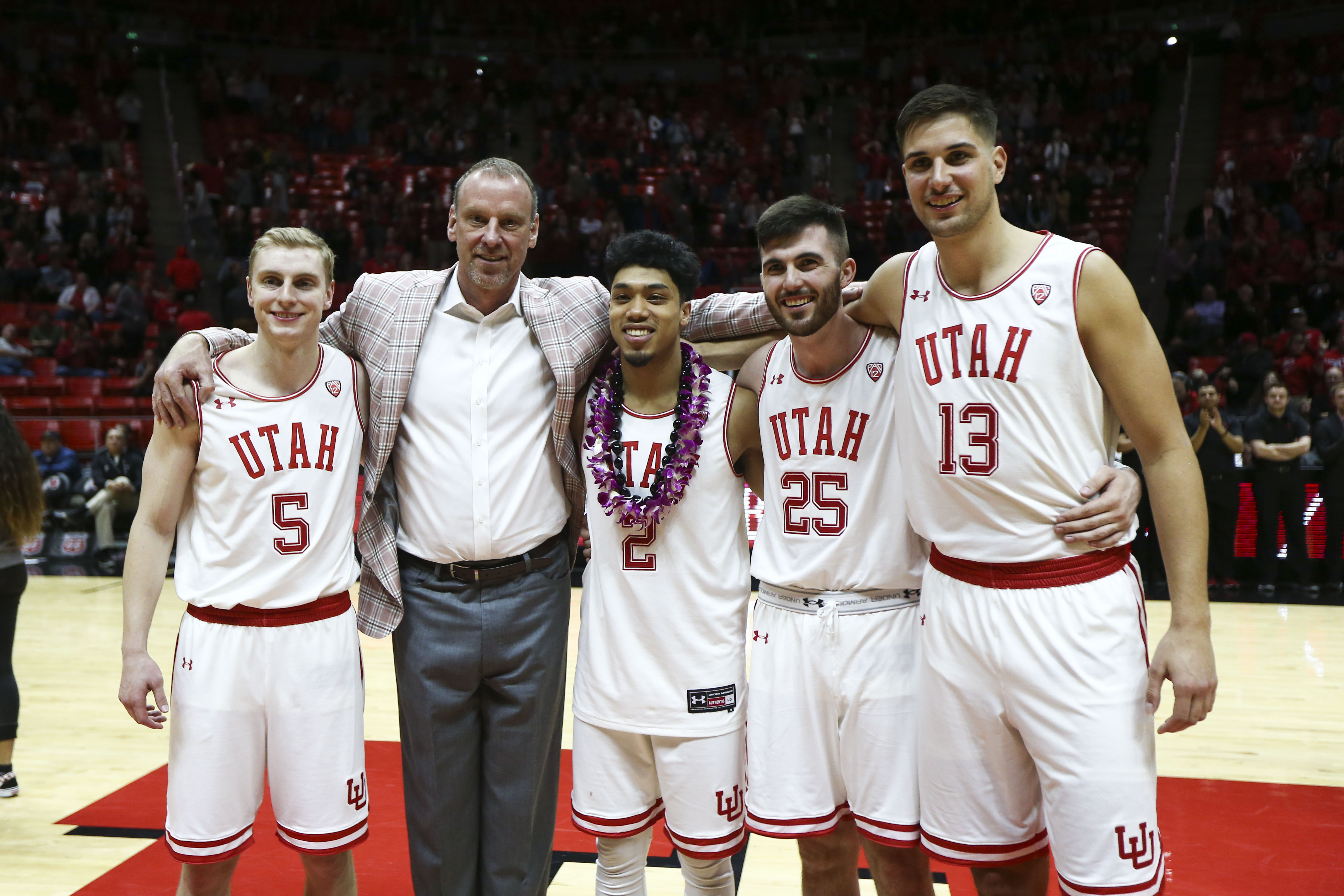 Utah Utes head coach Larry Krystkowiak stands with Utah Utes guard Parker Van Dyke (5), Utah Utes guard Sedrick Barefield (2), Utah Utes guard Beau Rydalch (25) and Utah Utes forward Novak Topalovic (13) during the senior night presentations after the Utah Utes beat the UCLA Bruins at the Huntsman Center in Salt Lake City on Saturday, March 9, 2019. (Photo: Silas Walker, KSL)