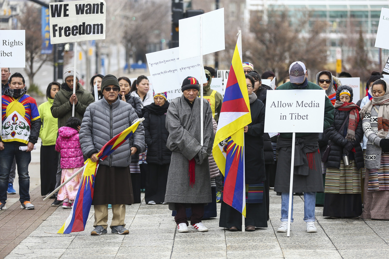 Tibetans prepare to march through downtown with signs and flags in a rally to commemorate the 60th anniversary of resistance to illegal occupation by Chinese government forces in Tibet on March 10, 1959 in Salt Lake City on Sunday, March 10, 2019. (Photo: Silas Walker, KSL)