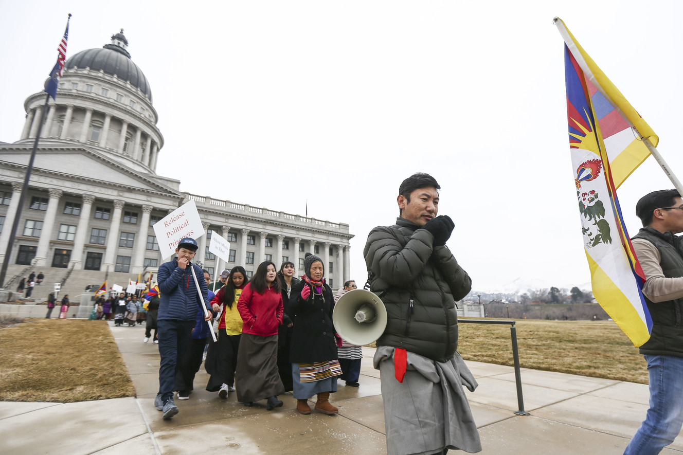 Tibetans march by the capitol with signs and flags in a rally to commemorate the 60th anniversary of resistance to illegal occupation by Chinese government forces in Tibet on March 10, 1959 in Salt Lake City on Sunday, March 10, 2019. (Photo: Silas Walker, KSL)