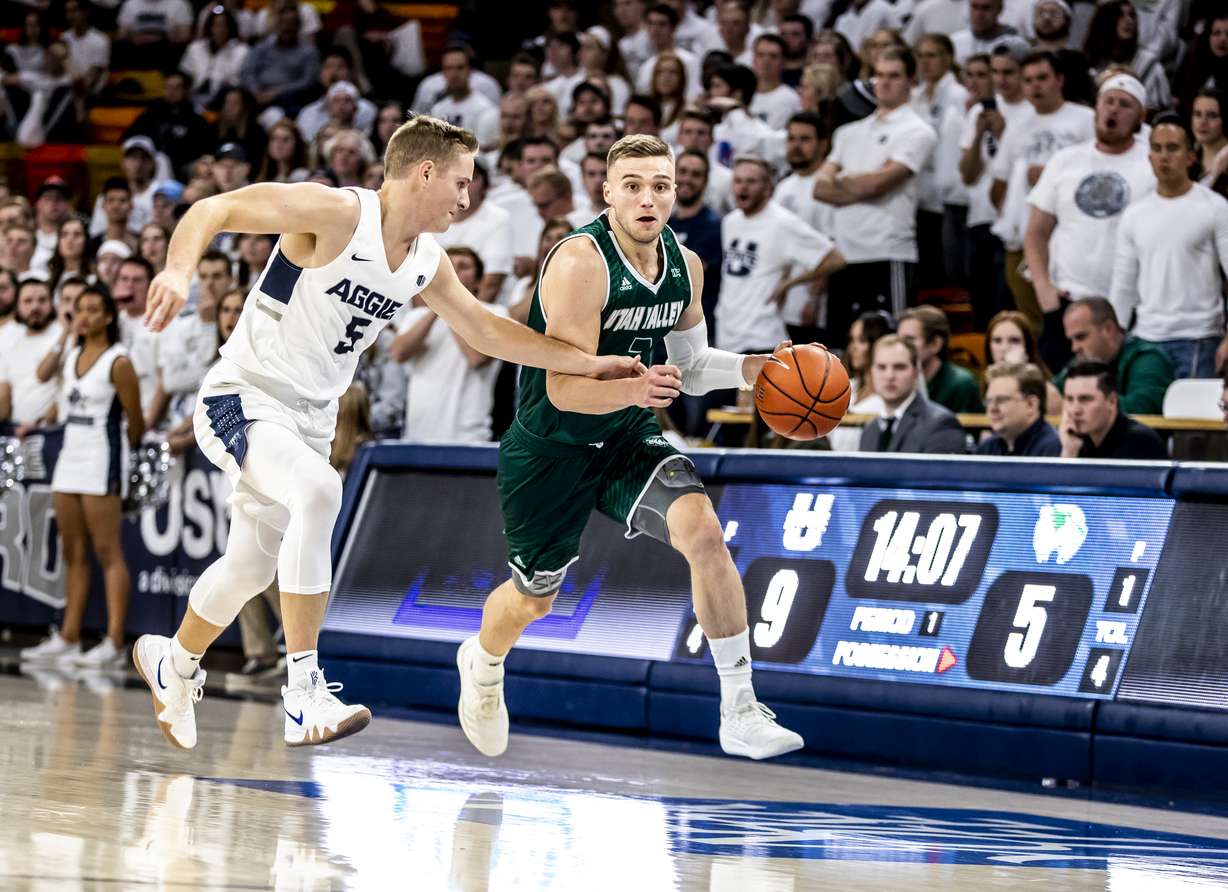 Utah State's Sam Merrill guards UVU's Jake Toolson during a game in Logan. (Courtesy: UVU Athletics)