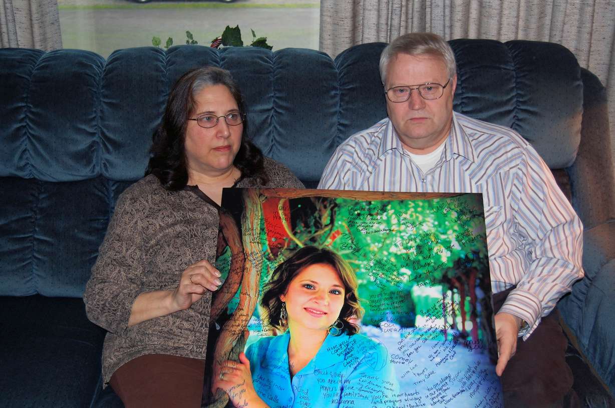 An undated photo of Chuck and Judy Cox holding a photo of their daughter Susan Powell, who was reported missing on Dec. 7, 2009. (Photo: Pat Reavy, KSL, File)