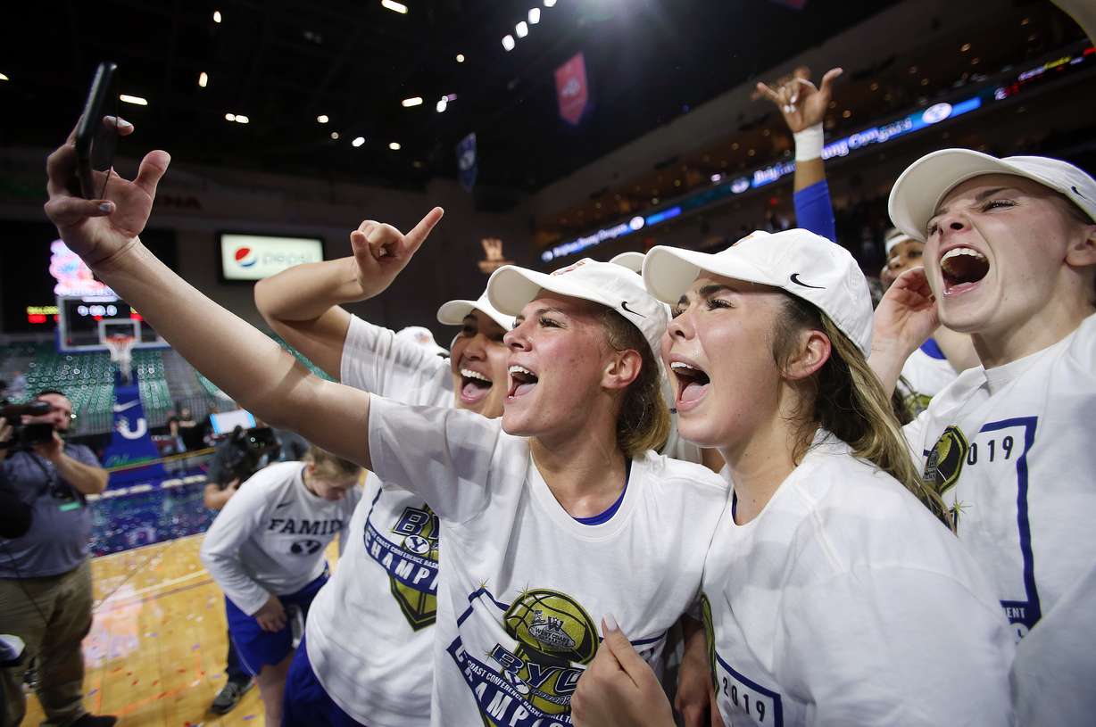 BYU players do a instagram video as they celebrate their win over Gonzaga to claim the WCC tournament championship at the Orleans Arena in Las Vegas on Tuesday, March 12, 2019. BYU won 82-68. (Photo: Scott G Winterton, KSL)